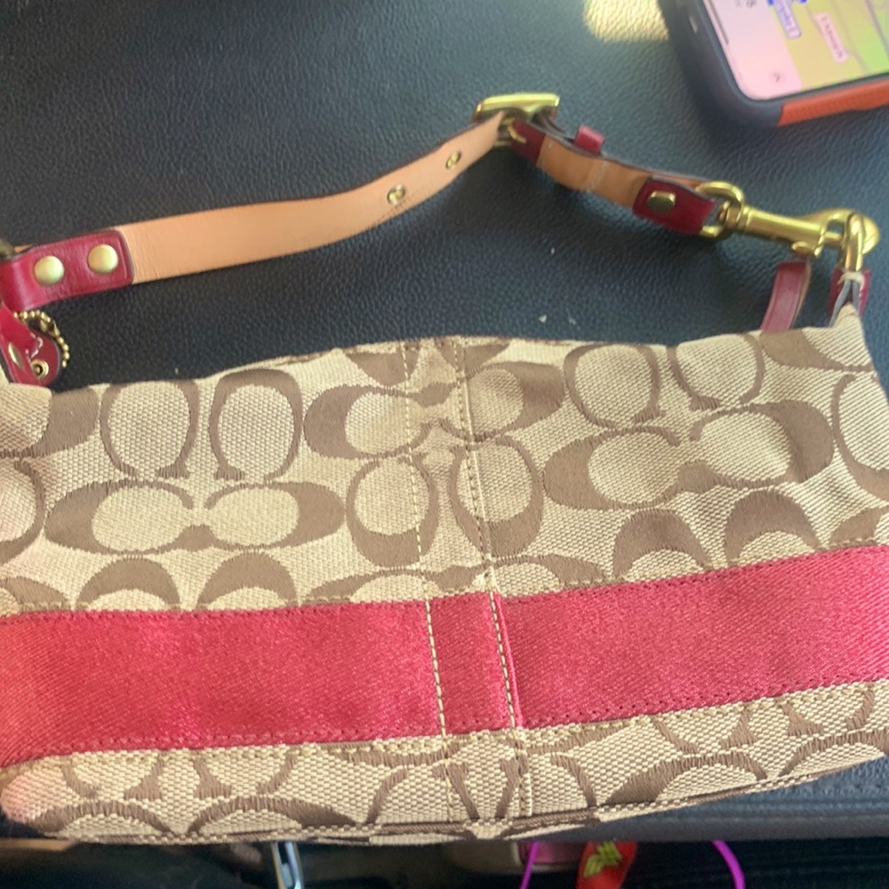 Coach small purse pink and tan great for a wallet n a few small items.